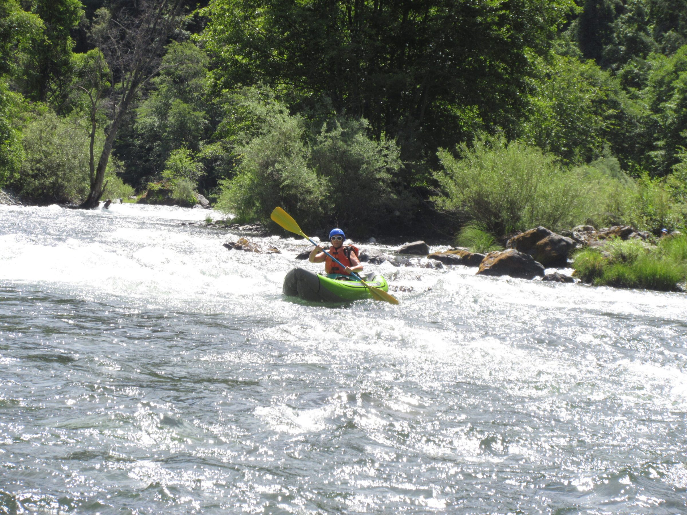 a man riding a snow board in the water