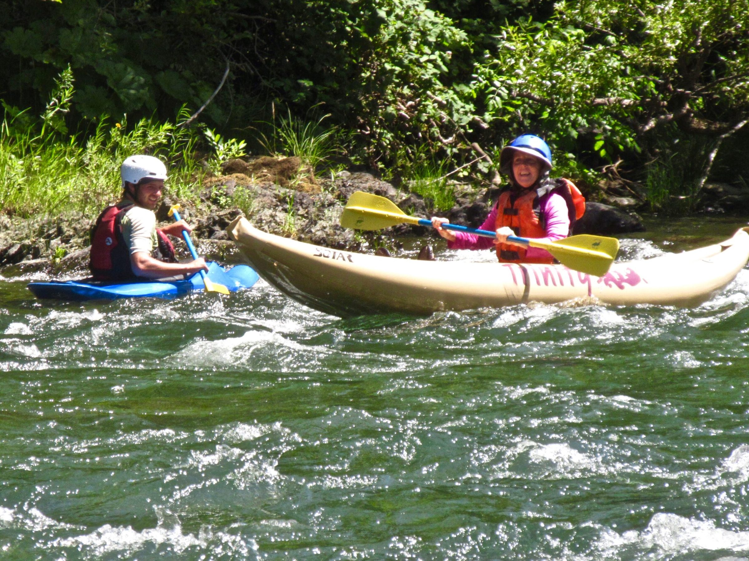 a group of people riding on the back of a boat