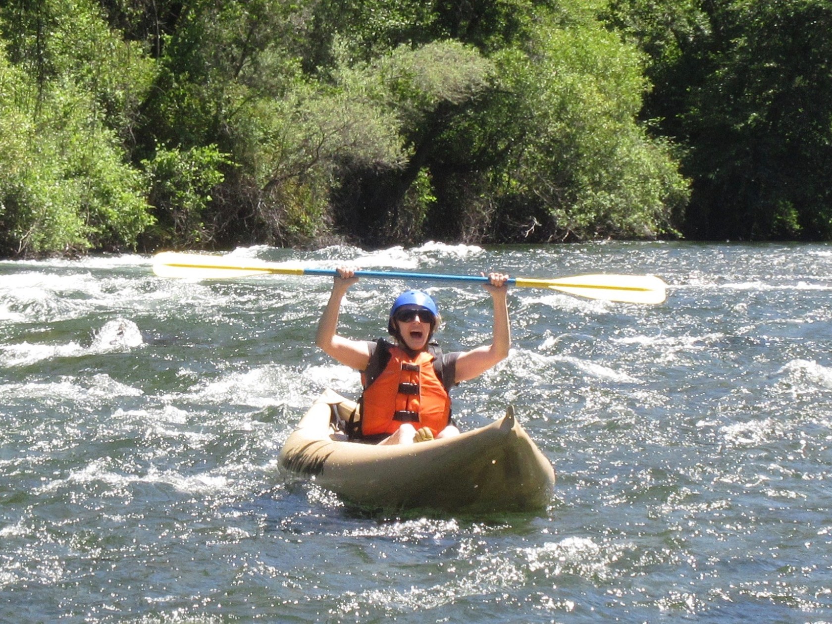 a young man riding a surfboard in the water
