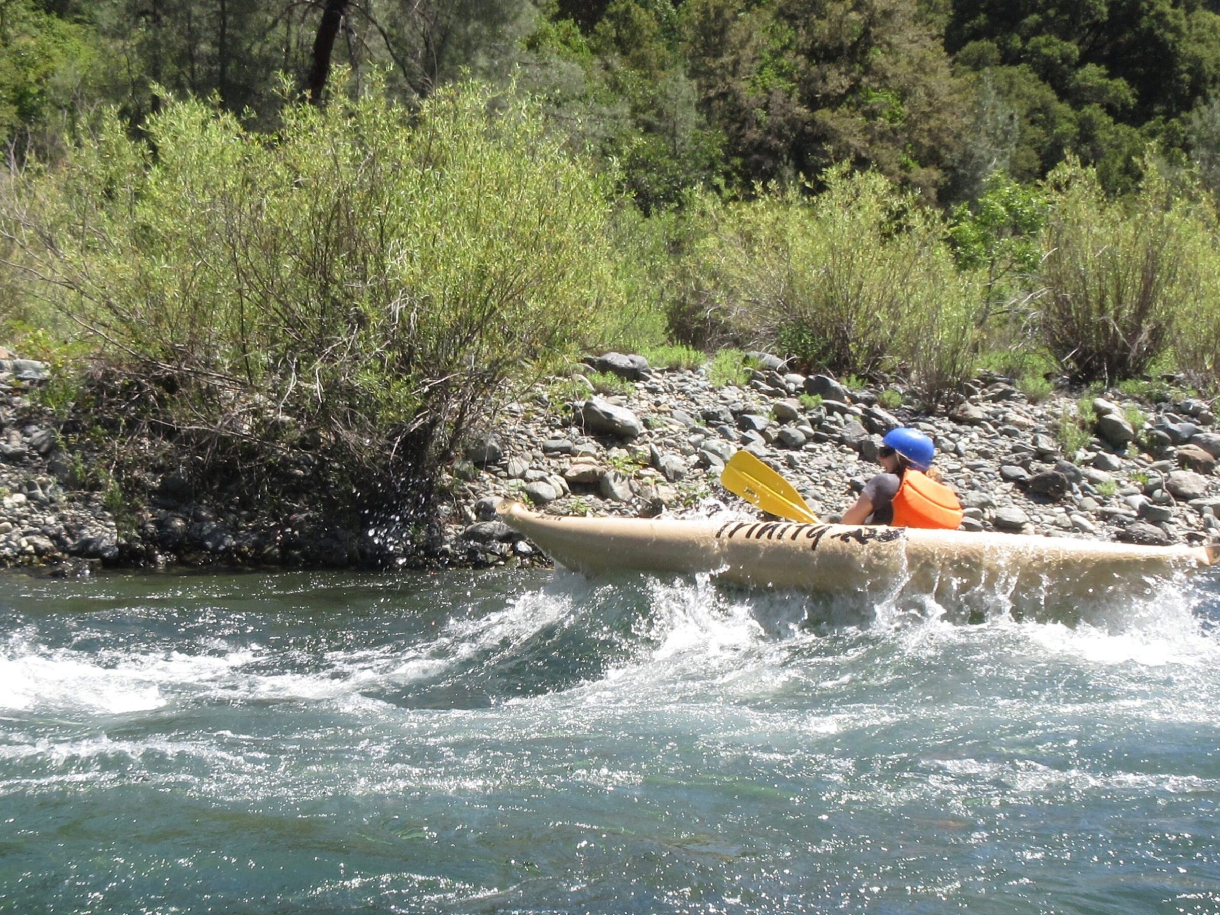 a man riding on a raft in a body of water