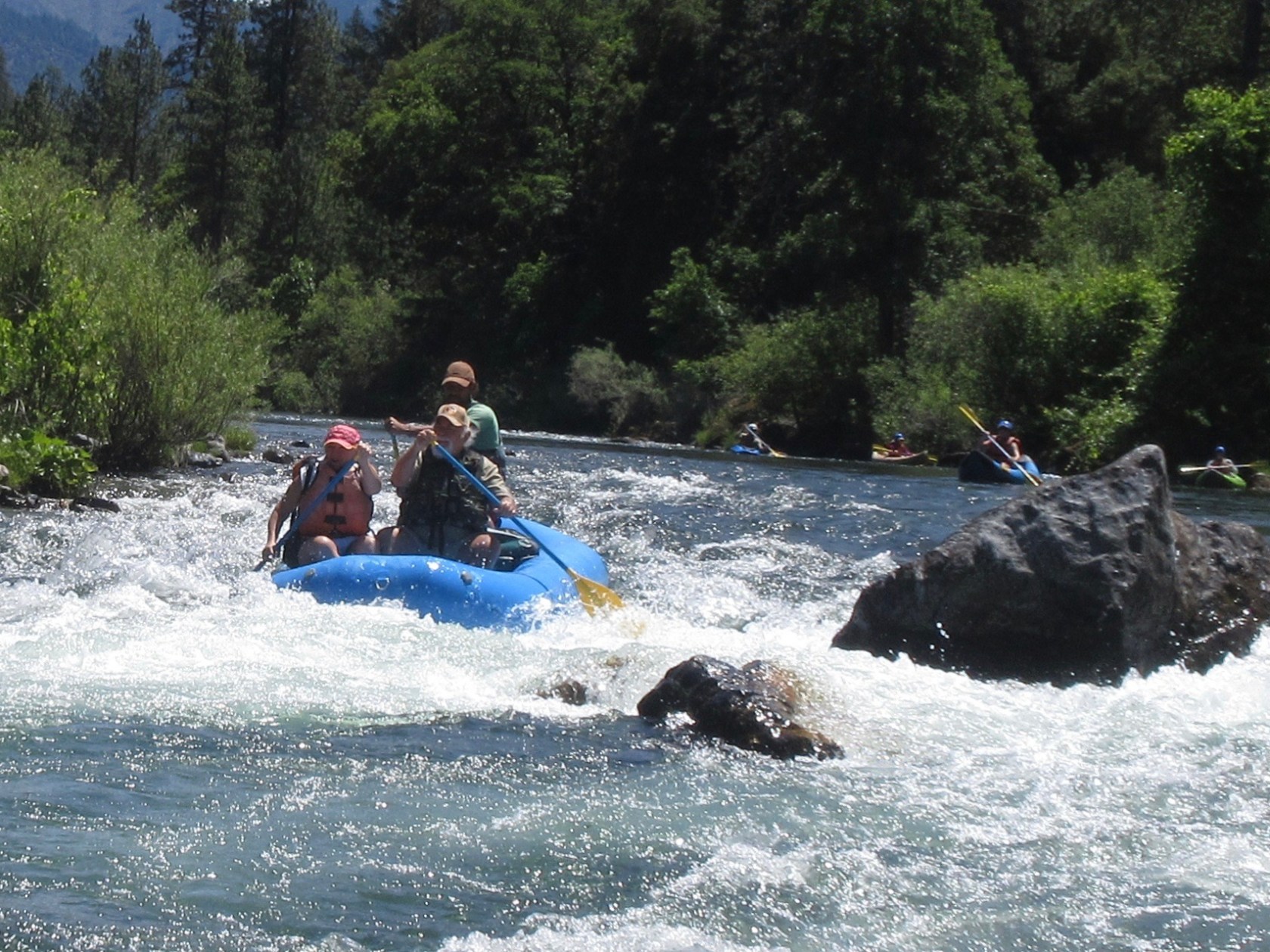 a group of people riding skis on a body of water