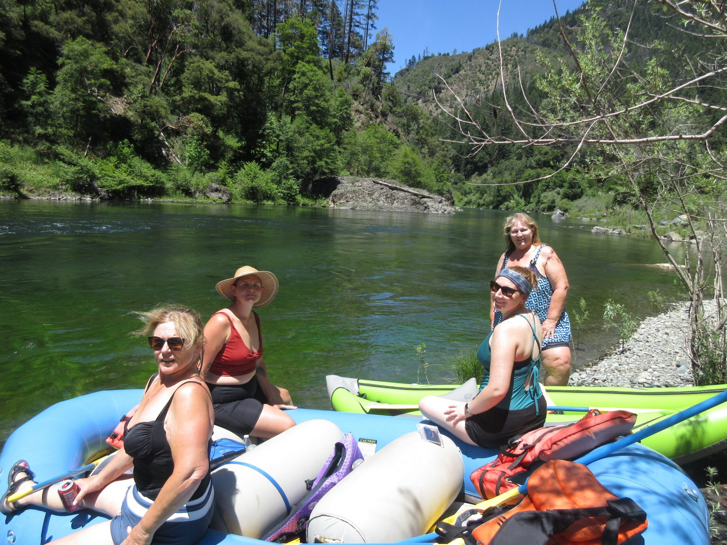 a group of people on a raft in a body of water