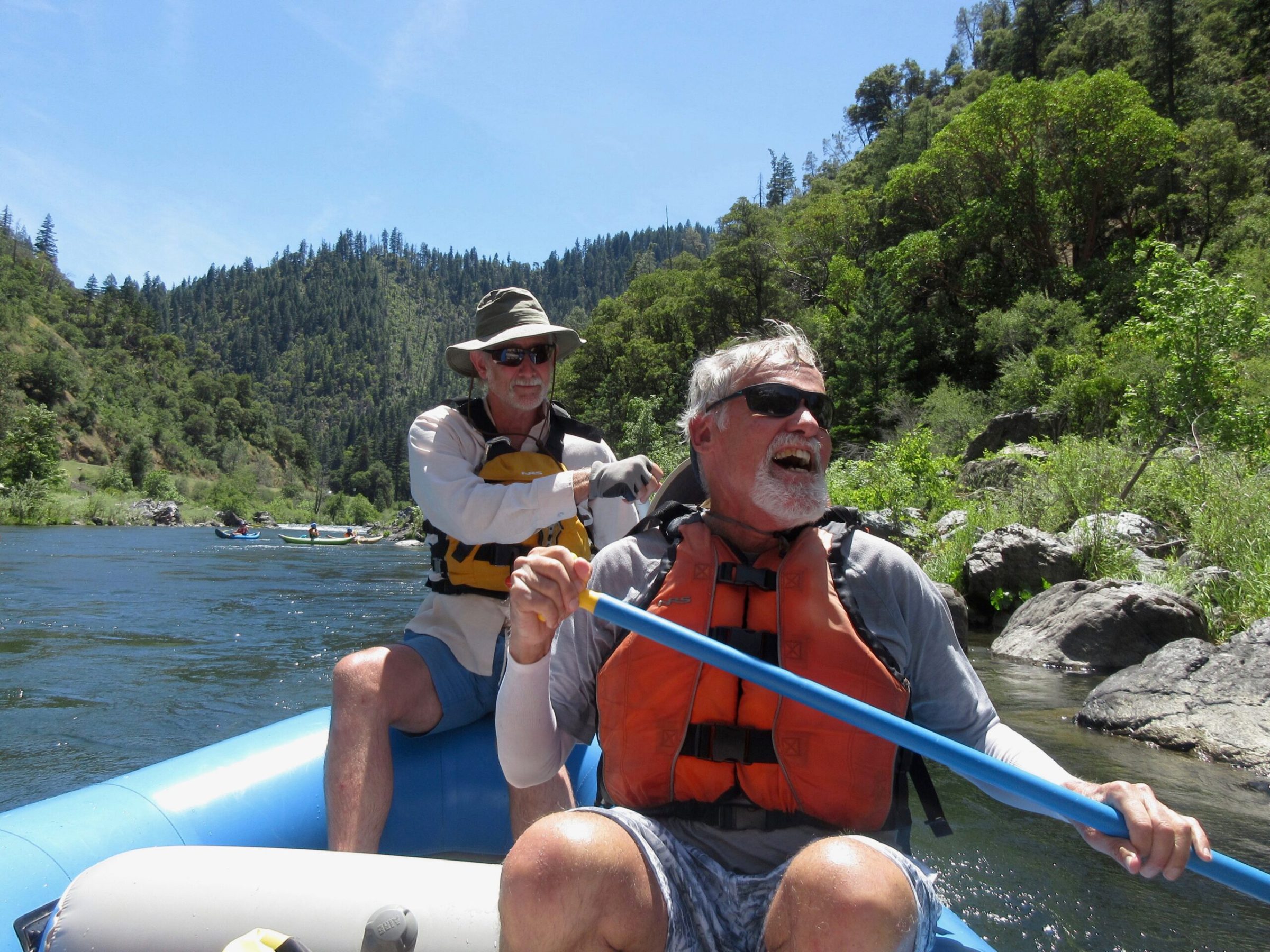 a man sitting on a raft in the water